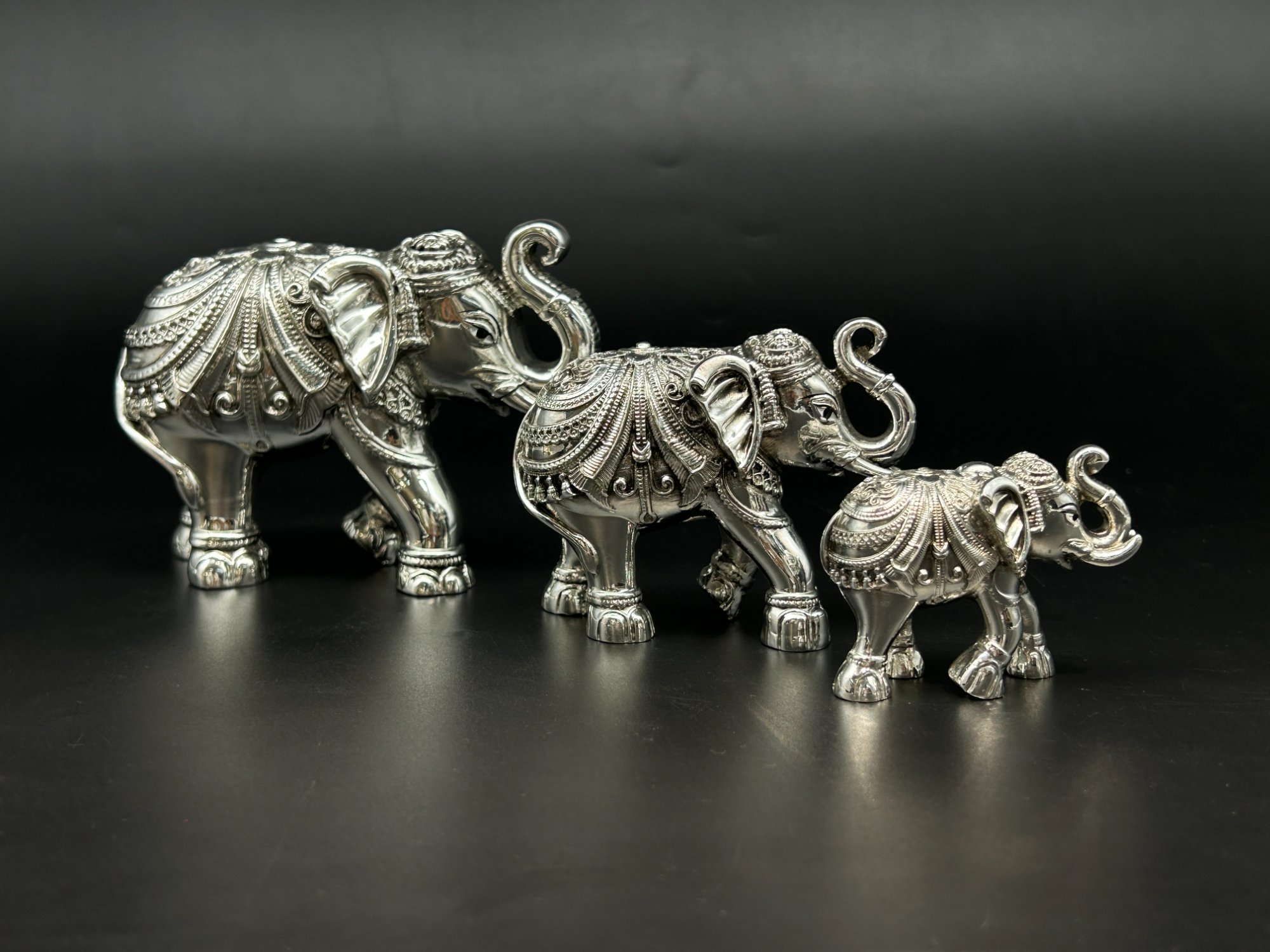 Elephant Trio Trunk Raised · Ascending
